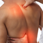Physiotherapist treating back pain with manual therapy techniques