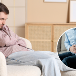 A man sitting on a couch holding his stomach in discomfort, showing signs of abdominal pain or bloating. An inset image highlights another person clutching their lower abdomen, indicating digestive distress or possible navel displacement.