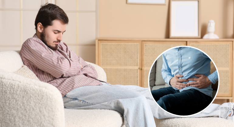 A man sitting on a couch holding his stomach in discomfort, showing signs of abdominal pain or bloating. An inset image highlights another person clutching their lower abdomen, indicating digestive distress or possible navel displacement.