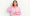 Young woman in a pink shirt smiling with one hand on her stomach and the other showing a thumbs up, symbolizing improved digestion from navel seed oil